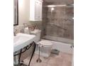Well-maintained bathroom with tiled shower, modern sink, and stylish fixtures at 7970 E Camelback Rd # 209, Scottsdale, AZ 85251