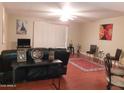 Spacious living room with hardwood floors, large windows, and ample natural light at 7970 E Camelback Rd # 209, Scottsdale, AZ 85251