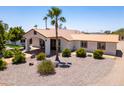 Beautiful desert home with a rust colored roof and xeriscaping at 920 N 104Th St, Mesa, AZ 85207