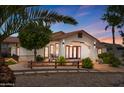 Inviting front exterior with a beautiful walkway and desert landscaping at 920 N 104Th St, Mesa, AZ 85207
