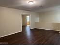 Cozy loft space offering versatile use with wood flooring and natural light throughout the room at 11016 W Griswold Rd, Peoria, AZ 85345