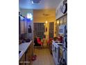 Well-lit kitchen with a breakfast nook, wood cabinets, and modern appliances at 14950 W Mountain View Blvd # 5303, Surprise, AZ 85374