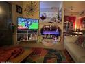 Inviting living room with a TV over a console and a peek into the dining area at 14950 W Mountain View Blvd # 5303, Surprise, AZ 85374