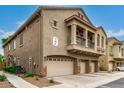 Exterior view of a two-story home with a three-car garage at 16620 S 48Th St # 79, Phoenix, AZ 85048