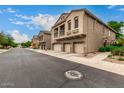 Street view of a neighborhood with two-story homes and three car garages at 16620 S 48Th St # 79, Phoenix, AZ 85048