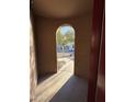 Arched entryway offers an intriguing glimpse into the home's design and layout at 1730 W Pollack St, Phoenix, AZ 85041