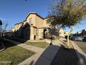 Charming home featuring a landscaped yard, sidewalk and a desert-friendly tree at 1730 W Pollack St, Phoenix, AZ 85041