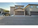 Attached two-car garage with neutral door color complementing the home's exterior at 1730 W Pollack St, Phoenix, AZ 85041
