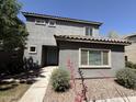 Charming two-story home with tidy landscaping, featuring a stucco facade, and tiled roof in a residential area at 1738 W Pollack St, Phoenix, AZ 85041