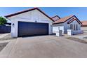 This single-story home includes a two car garage, desert landscaping and a concrete driveway at 2940 E Norwood St, Mesa, AZ 85213