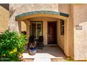 Inviting front porch with comfortable seating and a welcoming entrance at 3476 E Orchid Ln, Gilbert, AZ 85296