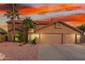 Charming two-story home boasts a spacious three-car garage and well-manicured desert landscaping at 3805 E Desert Flower Ln, Phoenix, AZ 85044