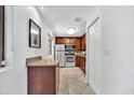 Charming kitchen featuring stainless steel appliances and dark wood cabinets, complemented by neutral countertops and ample storage at 4354 N 82Nd St # 167, Scottsdale, AZ 85251