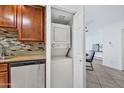 Convenient laundry closet with stacked washer and dryer, located adjacent to the kitchen and dining area at 4354 N 82Nd St # 167, Scottsdale, AZ 85251