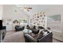 Well-lit living room with vaulted ceiling, comfortable seating, and large windows offering a welcoming and bright atmosphere at 441 S Maple -- # 83, Mesa, AZ 85206