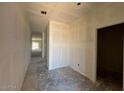 Spacious hallway leading to the rooms of the home at 47719 W Kenner Dr, Maricopa, AZ 85139