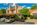 Inviting townhome with covered parking, mature landscaping, and a cozy front entrance at 4901 E Kelton Ln # 1052, Scottsdale, AZ 85254