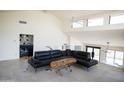 Spacious living area featuring high ceilings, modern tile floors, and a comfortable seating area at 5801 E Surrey Dr, Cave Creek, AZ 85331