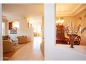 Spacious living room boasting a tray ceiling and archways leading to other rooms at 7413 E Russet Sky Dr, Scottsdale, AZ 85266