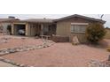 Front exterior view of a brick home with low maintenance desert landscaping at 962 S Main Dr, Apache Junction, AZ 85120
