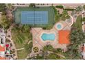 An aerial view features a pool, tennis court, landscaped surroundings, and community amenities at 11633 N 40Th Way, Phoenix, AZ 85028