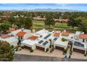 Aerial view of a condo community with solar panels and well-manicured lawns at 11633 N 40Th Way, Phoenix, AZ 85028
