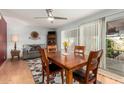 Inviting dining area with a wooden table and seating for four, adjacent to a cozy sitting area at 1409 S Revere --, Mesa, AZ 85210