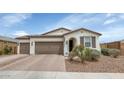 Beautiful single-story home with desert landscaping, a two-car garage, and attractive architectural details at 19806 W Marshall Ave, Litchfield Park, AZ 85340
