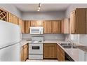Efficient kitchen offers generous cabinet space, white appliances, and practical countertops at 2929 W Yorkshire Dr # 2074, Phoenix, AZ 85027