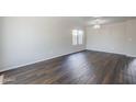 Bright living room with large window and neutral paint at 3018 W Horsham Dr, Phoenix, AZ 85027