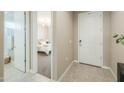 Light and bright foyer with tile flooring leading to the bedroom at 37903 W San Clemente St, Maricopa, AZ 85138