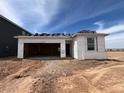 New home construction shows a two-car garage and under-construction roof at 47450 W Kenner Dr, Maricopa, AZ 85139