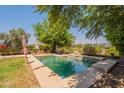 Backyard pool with a relaxing lounge area, perfect for outdoor enjoyment at 7169 S Dodane Ct, Gilbert, AZ 85298