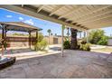 Relaxing backyard featuring a covered patio, a gazebo, mature landscaping, and privacy fence at 7424 E Cambridge Ave, Scottsdale, AZ 85257