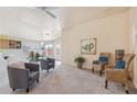 Bright and airy living room with plush carpeting, comfortable seating, and neutral walls create a relaxing atmosphere at 9175 E Rainier Dr, Gold Canyon, AZ 85118