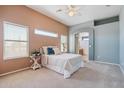 Inviting main bedroom with carpeted floor, neutral walls, bright windows, and an ensuite bathroom, creating a peaceful retreat at 9175 E Rainier Dr, Gold Canyon, AZ 85118