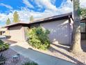 Home exterior featuring desert landscaping, private courtyard, and mature tree at 924 S Hacienda Dr # C, Tempe, AZ 85281