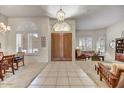 Bright foyer featuring tiled floors, double doors, and an open layout into the living spaces at 1092 N Roosevelt Ave, Chandler, AZ 85226