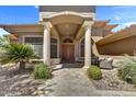 Stunning front entrance with stone pathway, covered porch, and custom double doors at 1092 N Roosevelt Ave, Chandler, AZ 85226