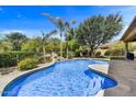 Inviting swimming pool surrounded by mature landscaping creating a private backyard oasis at 1092 N Roosevelt Ave, Chandler, AZ 85226