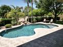 A private backyard pool includes a rock waterfall feature and a spacious patio area at 1092 N Roosevelt Ave, Chandler, AZ 85226