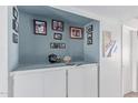 Stylish built-in shelving and cabinet, perfect for displaying decor at 13408 N 25Th Dr, Phoenix, AZ 85029