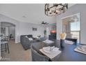 Open floor plan showcases a living room and dining area bathed in natural light at 14250 W Wigwam Blvd # 2722, Litchfield Park, AZ 85340