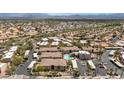 Aerial view of a community featuring multiple tan buildings, desert landscaping, and a community pool at 14815 N Fountain Hills Blvd # 101, Fountain Hills, AZ 85268