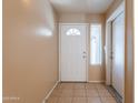 Bright entryway featuring tile flooring, neutral walls, and front door with sidelight window at 16021 N 30Th St # 122, Phoenix, AZ 85032