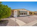 Inviting single-story home with awning, walkway, and desert-friendly landscaping at 16215 N 35Th Way, Phoenix, AZ 85032