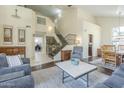 Spacious living room with high ceilings, a staircase, and plenty of natural light at 2114 E Escuda Rd, Phoenix, AZ 85024