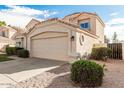 Attractive single-story home showcasing desert landscaping and a convenient two-car garage at 2134 W Peninsula Cir, Chandler, AZ 85248