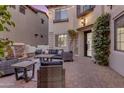 Inviting outdoor courtyard with patio furniture, water feature, and lush greenery at 22317 N 39Th Run, Phoenix, AZ 85050
