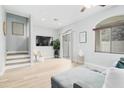 Bright living room with hardwood floors, recessed lighting, and access to outdoor patio area at 2402 E 5Th St # 1498, Tempe, AZ 85288